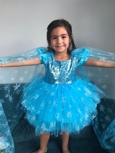 - Inspired by the snow country princess elsa, our blue tutu tulle dress is designed as a mini and a tail extending from the shoulders to the ground has been added. -Snowy tulle is used in the tail part of our dress, which consists of quality sequin fabric and dream tulle. - GENERAL EXPLANATION - Perfect for birthdays, photo shoots or parties. We produce children's dresses for any occasion, whether it's a birthday party, a bridesmaid, colorful, floral, tutu, satin or lace. - All dresses are made Winter Princess Style Tutu Dress For Party, Princess Style Tutu Dress For Winter Party, Princess Style Winter Party Tutu Dress, Elsa Frozen Toddler Costume, Blue Princess Fairy Dress For Fancy Dress, Princess Style Blue Fairy Dress For Fancy Dress, Blue Princess Style Fairy Dress For Fancy Dress, Winter Fitted Tulle Princess Dress, Winter Princess Style Tutu Dress In Tulle