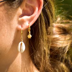 This listing is for 1 pair of Cowrie Shell Hoop Earrings. The shells are real Cowrie Shells. The hoops are 12mm gold plated. The base metal is brass. Nickel and lead free. For best use it is recommended to not wear to bed or in water. Shell Hoop Earrings, Cowrie Shells, Cowrie Shell, Shell Earrings, Shipping Orders, Huggie Hoop Earrings, Beach Aesthetic, Earrings Photo, Huggies Earrings