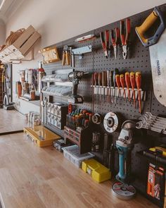 tools are hanging on the wall in a shop