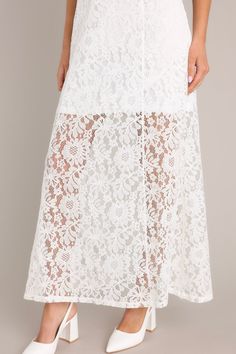 Show off all that Irresistible Charm in this darling maxi dress! Take in all the lace details and classic silhouette and know you've made the perfect choice! This dress features a high round neckline, a slip up the side, and a lace overlay with a lining that extends from the shoulder to the mid-thigh. 65% Cotton, 35% Nylon Hand Wash Cold Lined 100% Polyester Manufactured in China Designed in the USA Model is wearing a size x-small. Palm Royale, White Lace Maxi Dress, White Lace Maxi, Lace Layers, China Design, Red Dress Boutique, Walk Out, Lace Maxi, Lace Maxi Dress