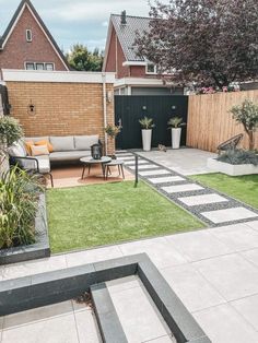 an outdoor living area with grass and plants