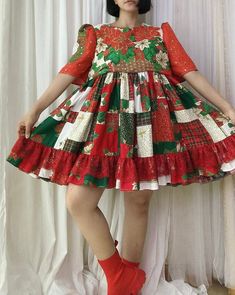 a woman in a red and green christmas dress