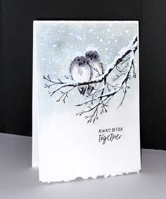 a card with two birds sitting on top of a tree branch in the snow, saying always better together