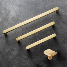 three wooden handles and two stools on the floor