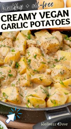 creamy vegan garlic potatoes in a skillet with text overlay