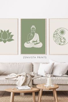 three green and white art prints on the wall above a couch in a living room