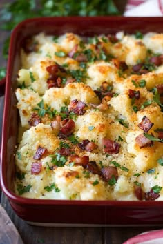 a casserole dish with bacon, cheese and parsley