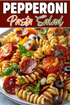 this pasta salad has pepperoni, tomatoes, and olives