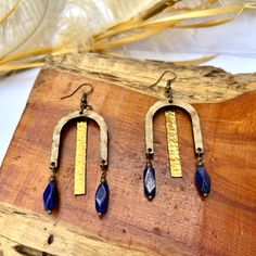 Unique statement earrings with hammered brass hanging from a patina'd wood piece & accented with blue Lapis dangles. Earring Inspo, Hammered Brass, Handmade Earring, Statement Earring, Glitter Glass, Blue Lapis, Leather Fringe, Fringe Earrings, Wood Pieces