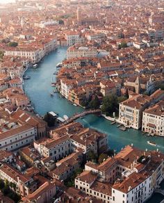 an aerial view of venice, italy with the river running through it and buildings on both sides