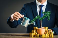 a man in a suit pouring money into a pot with a tree growing out of it