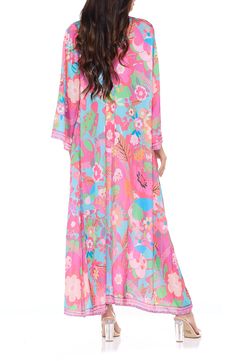 Go from beach to boardwalk in a flowery border-print cover-up wrap with a front-tie closure for easy layering. 54" length Shawl collar Long sleeves 100% polyester Hand wash, dry flat Imported Flowy Beachwear Cover-up For Spring, Flowy Spring Beachwear Cover-up, Flowy Spring Cover-up For Beach Party, Summer Floral Print Cover-up For Vacation, Spring Vacation Floral Print Cover-up, Beachy Multicolor Cover-up For Spring, Spring Tropical Print Cover-up For Poolside, Flowy Tropical Cover-up With Floral Print, Flowy Spring Loungewear Cover-up