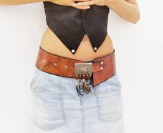 Boho chic style belt, painted entirely by hand with ecological dyes, in brown and shaded with black. The buckle is very special, the decor with pieces of silver , which give air even more gipsy. Belt very wearable, both hip and waist. Measurements: width- 8cm. Sizes: S- 86cm. M- 103cm L - 116 cm. XL- 131 cm (+ 25€). If you have any questions do not hesitate to contact me, I answer you gladly :) Thank you! And Much Love Bohemian Antique Belt Buckles For Festivals, Antique Brown Belt Buckle For Festival, Brown Antique Buckle Belt Buckles For Festival, Bohemian Leather Adjustable Belt Buckles, Bohemian Adjustable Belt With Antique Buckle, Adjustable Bohemian Belt With Antique Buckle, Bohemian Brown Belt For Festival, Adjustable Bohemian Belt Buckles For Festivals, Bohemian Belt Buckles For Festivals