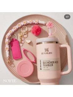 a pink cup and some items on a plate