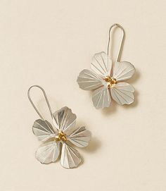 Our charming Sayuri collection features etched, silver finish floral elements with gold finish metallic bead embellishment in joyful, refined designs. These silver flower earrings are ethically handcrafted by master artisans in Old Delhi. Artisans utilize age old Indian jewelry craft techniques and tools to transform recycled metal materials into modern, upcycled works of art. These unique drop earrings feature a flower design comprised of etched, silver finish pedals with dainty gold finish bea Flower Petal Jewelry, Unique Drop Earrings, Old Delhi, Bead Embellishment, Craft Techniques, Silver Flower Earrings, Floral Elements, Handmade Brass, Nature Inspired Jewelry