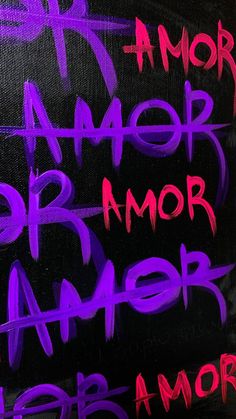 graffiti written on the side of a building in purple and black colors with words underneath it