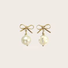 Mini Coquette Bow with Shell Sphere Earrings - Sunday Girl by Amy DiLamarraEarrings White Pearl Earrings With Bow For Party, Elegant White Earrings For Holiday, Elegant White Holiday Earrings, Gold Feminine Pearl Earrings For Party, Feminine Gold Pearl Earrings For Party, Handmade Gold Pearl Earrings For Party, Gold Pearl Earrings With Bow For Gift, Gold Pearl Earrings With Bow As Gift, Sphere Earrings