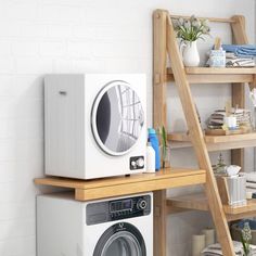 a washing machine sitting on top of a wooden shelf