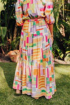 - Spread some sunshine in this vibrant skirt! - Colorful material with a geometric print - A built-in partial lining that ends knee length - An elastic waistline - A flowy silhouette that ends in a maxi length hemline Multicolor Maxi Dress With Elastic Waistband For Summer, Elegant Multicolor Maxi Dress With Elastic Waistband, Summer Maxi Dress With Elastic Waistband And Flared Skirt, Spring Vacation Skirt With Vibrant Print, Vibrant Beach Skirt For Spring, Vibrant Print Skirt For Summer, Vibrant Print Summer Skirt, Vacation Midi Skirt With Elastic Waistband, Midi Skirt With Elastic Waistband For Vacation