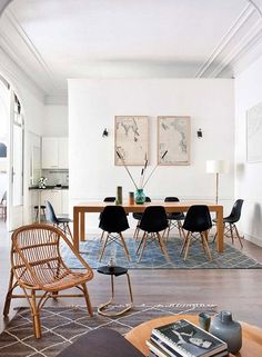 a living room filled with furniture and a dining table