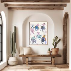 a living room with cactus, potted cacti and an art work on the wall