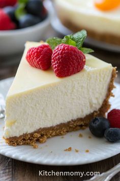 a slice of cheesecake with fresh berries on top