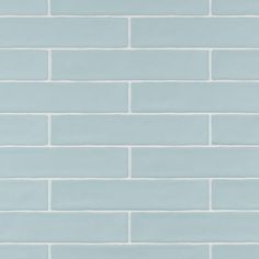 a light blue brick wall with white bricks