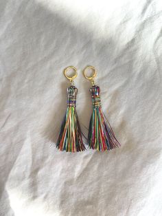 These tassel earrings are a sweet and fun way to add flair to any festival or birthday outfit. Super light weight and versatile.  The posts are 14k gold plated and the tassel is made with tinsel. Multicolor Beaded Tassel Dangle Earrings, Festival Multicolor Tassel Earrings With Colorful Beads, Multicolor Tassel Earrings For Festival, Tinsel Tassel, Rainbow Tassel Dangle Earrings, Multicolor Tassel Earrings, Tassel Earrings, Birthday Outfit, Tassels