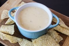 a bowl of dip surrounded by tortilla chips