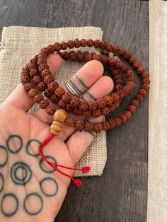 ------Price per Item------ Small Rudraksha 108 mala necklace that can be used as a bracelet also. Small rudraksha beads, creating this simple yet powerful mala necklace for you to add to your mala collection. The mala necklace is13.75 inch long without the tassels. A necklace to keep you in styke and grounded at the same time. ⚡️GET 20% OFF NOW⚡️ JOIN AKASHI'S VIP LIST and Shop ⚡️Join Akashi's VIP list for early bird discount access⚡️ Paste into your browser http://eepurl.com/hgCMM1 and follow t Spiritual Mala With 8mm Beads, Spiritual Beaded Bracelets For Rituals, Holistic Mala With 108 Beads For Festival, Adjustable Spiritual Mala With 8mm Beads, Bohemian Mala With 108 Round Beads, Bohemian Mala With 108 Beads, Bohemian 108 Beads Round Mala, Adjustable Spiritual Hand-strung Mala, Spiritual Hand-strung Beads As Gifts