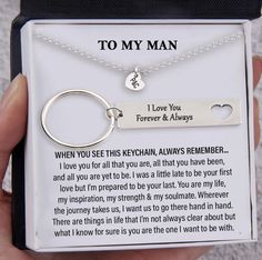 a person holding a keychain that says to my man i love you forever and always