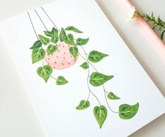 a drawing of a strawberry hanging from a plant with green leaves and dots on it