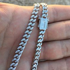 Men's Miami Cuban link hip hop chain. Solid 925 sterling silver with rhodium finish. Chain measures 24" inches by 6 mm thick. Has a good weight to it at 60 total grams. Fully micro paved high quality hand set cz. Features a stylish fully iced box clasp. You can take a shower with this chain on. Will not ever rust or turn your skin green. Buy confidently with our 30 day guarantee. 100% FREE SHIPPING in USA. Order now! Silver Cuban Link Chain Necklace Iced Out, Silver Iced Out Cuban Link Necklace, Iced Out Silver Cuban Link Necklace, Silver Cuban Link Iced Jewelry, Silver Cuban Link Iced Necklace, Silver Iced Cuban Link Necklace, Iced Silver Cuban Link Necklace, Silver Cuban Link Necklace Iced Out With Cubic Zirconia, Silver Cuban Link Necklace With Iced Out Cubic Zirconia