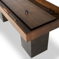 a pool table that has been made with wood and metal inlaying the top