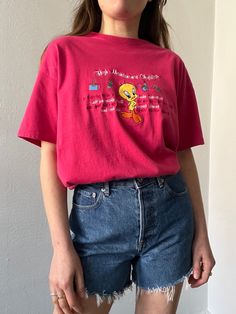 Pink 100% cotton crew neck t-shirt with Tweety Bird stitched on the front along with various text under "High Maintenance Checklist". In excellent vintage condition. DETAILSLabel: Warner Bros.Material: 100% Cotton SIZE & MEASUREMENTSTag Size: Large Length: 28"Bust: 42"Waist: 42"Sleeve: 7"Shoulder: 20.5" Vintage Text Print Crew Neck Shirt, 90s Cotton Tops With Embroidered Graphics, 90s Embroidered Cotton Tops, Vintage Crew Neck T-shirt With Text Print, Retro Embroidered Streetwear Tops, Retro Cotton T-shirt With Embroidered Graphics, Retro Embroidered Tops For Streetwear, Retro Tops With Embroidered Graphics For Streetwear, Retro Embroidered Graphics Tops For Streetwear