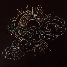 the sun and clouds are drawn with colored thread