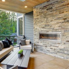 a living room with two couches and a fireplace