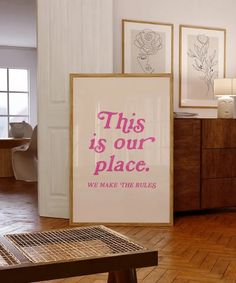 this is our place we make the rules poster in front of a coffee table and dresser