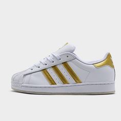 Girls White And Gold Adidas Sneakers Brand New Adidas White High-top Skate Shoes, White Adidas Sneakers With Round Toe, Sporty Gold Sneakers For Spring, White Adidas Skate Shoes With Synthetic Material, White Adidas Synthetic Skate Shoes, White Adidas Skate Shoes With Logo, White Adidas Lace-up Skate Shoes, White Skate Shoes With Gum Sole For Spring, Gold Slip-on Sporty Sneakers