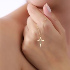 Illuminate your style with our exquisite 14K North Star Necklace, a celestial symbol of guidance and inspiration. Crafted from high-quality 14K solid gold, this necklace blends timeless elegance with celestial charm. 2- P R O D U C T ∙ F E A T U R E S: * Gold material: 14k solid gold * Choice of chain length: 14",16", 18", 20" * Dainty North Star pendant for a touch of celestial elegance * Dimensions: Pendant Height: Pendant Width:  3- D E L I V E R Y ∙ D E T A I L S: We are eager for you to rec Elegant Gold Necklace, North Star Necklace, Jewelry Elegant, White Gold Chains, Celestial Jewelry, Star Gift, North Star, Star Pendant, Star Charms