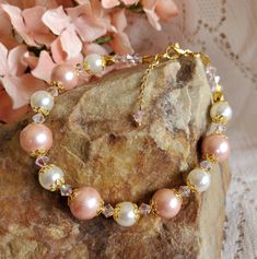 Peach and pearls in this beautiful bracelet. A lovely addition to any outfit! A lovely gift for all the special people in your life, including yourself! Measures 8 inches, and fits a 7 to 8 inch wrist nicely. Cheap Peach Beaded Bracelet Gift, Peach Round Beads Bracelet As Gift, Adjustable Peach Beaded Bracelet As Gift, Adjustable Peach Bracelet, Peach Bracelet, Strand Bracelet, Pearl Beads, Pearl Jewelry, Beautiful Bracelet