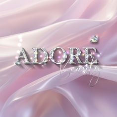 the word adore is surrounded by shiny letters and sparkles on a pink background