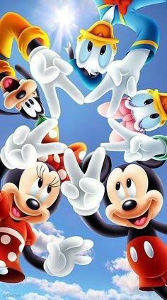 mickey mouse and friends flying in the sky