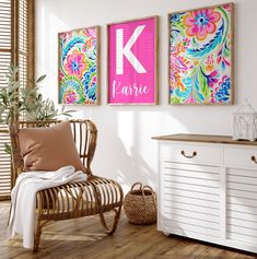 a chair sitting next to a white dresser in a room with two paintings on the wall