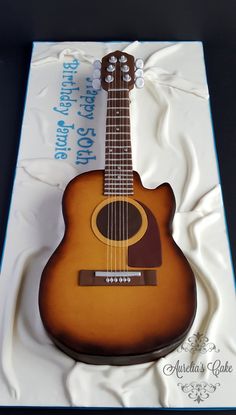 a cake shaped like an acoustic guitar