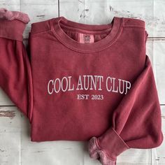 Comfort Color® Embroidered Cool Aunt Club Sweatshirt is the perfect blend of style, comfort, and personalized charm. Featuring an embroidered "Cool Aunt Club" design, it celebrates the special bond between aunt and niece/nephew. But the customization doesn't end there – you can add a custom est year or children's names on the sleeve, making each sweatshirt a unique gift. Available exclusively on embroly.com, this auntie sweatshirt is a must-have for proud aunts everywhere. Visit the website and Cool Aunt Club, Auntie Sweatshirt, Aunt And Niece, Cool Aunt, Club Sweatshirts, Aunt Gifts, Club Design, Niece And Nephew, Comfort Color