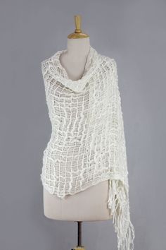 From Sandeep Malhotra this novel shawl is trendy and lightweight. Ivory yarns in varying thicknesses flow together in a voluptuous open weave wrap. One Size White Wrap, White Dupatta For Spring, White One Size Wrap, White Shawl For Spring, Spring White Shawl Dupatta, White One-size Wrap, White Shawl Wrap, White Shawl Wrap Scarf, Luxury White Bohemian Pashmina Shawl