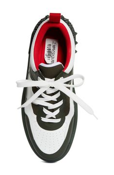 A '90s-inspired street-savvy silhouette that borrows from basketball and skate shoes of the era defines this mixed-media sneaker bristled with signature spikes. Lace-up style Removable insole Leather and textile upper/textile lining/synthetic sole Imported Designer Shoes Low-top Chunky Sneakers With Perforations For Streetwear, Sporty Skate Shoes With Perforations For Streetwear, Low-top Basketball Shoes With Studded Rubber Outsoles, Sporty Lace-up Basketball Shoes With Studded Outsoles, High-top Chunky Sneakers With Perforations For Streetwear, Casual Chunky Sneakers With Perforations For Streetwear, Casual Chunky Perforated Sneakers For Streetwear, Sporty Mid-top Basketball Shoes With Studded Outsoles, Sporty Basketball Shoes With Studded Rubber Outsoles