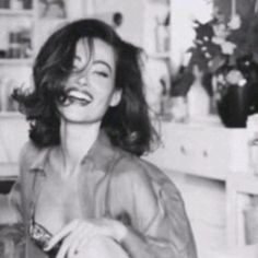 black and white photograph of a woman brushing her teeth