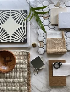 the table is covered with assorted items such as napkins, plates and cups